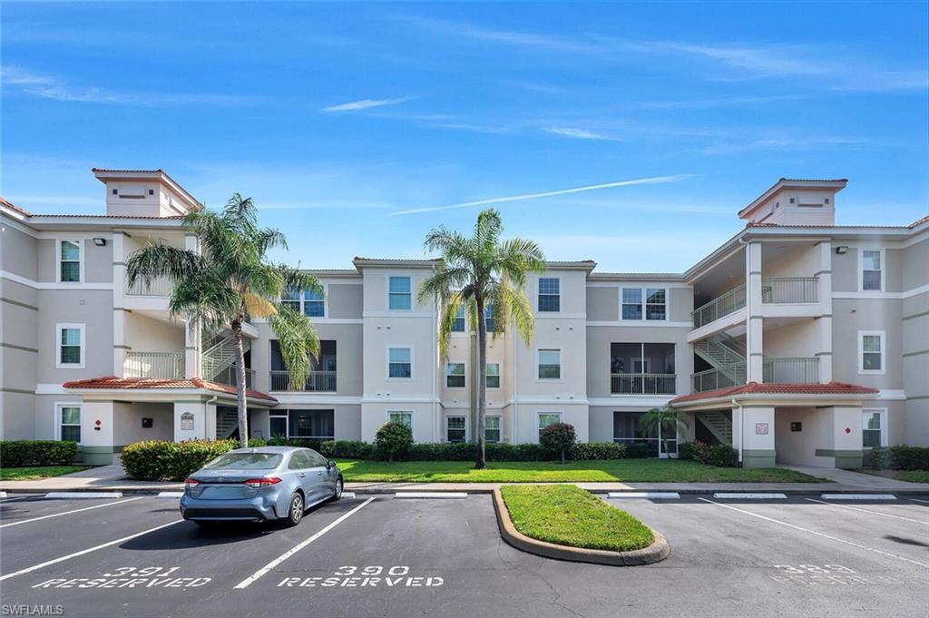 Image 2: View of apartment building / complex with uncovered parking