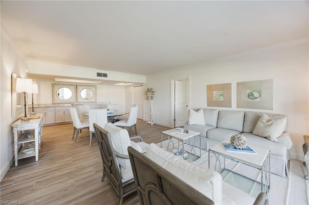 Image 3: Open floor plan  through the main living areas delights the eye.