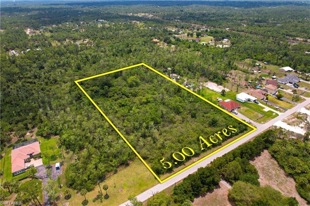 Image 3: Aerial overview of property's location with a forest and property parcel outlined