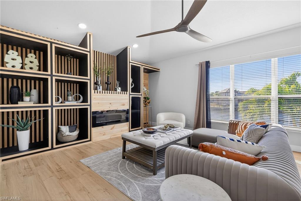 Image 4: Living room featuring ceiling fan, wood finished floors, and recessed lighting