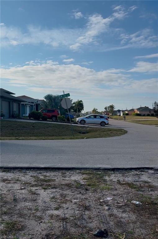 Image 1: View of asphalt street out front