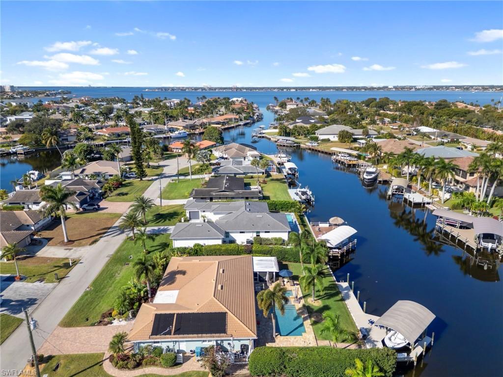 Image 1: View of property location with a large body of water and nearby suburban area