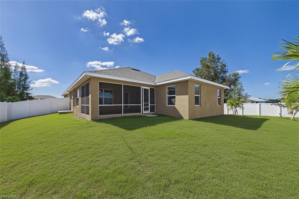 Image 3: 6 ft fence surrounds yard. Room to add pool or just enjoy.