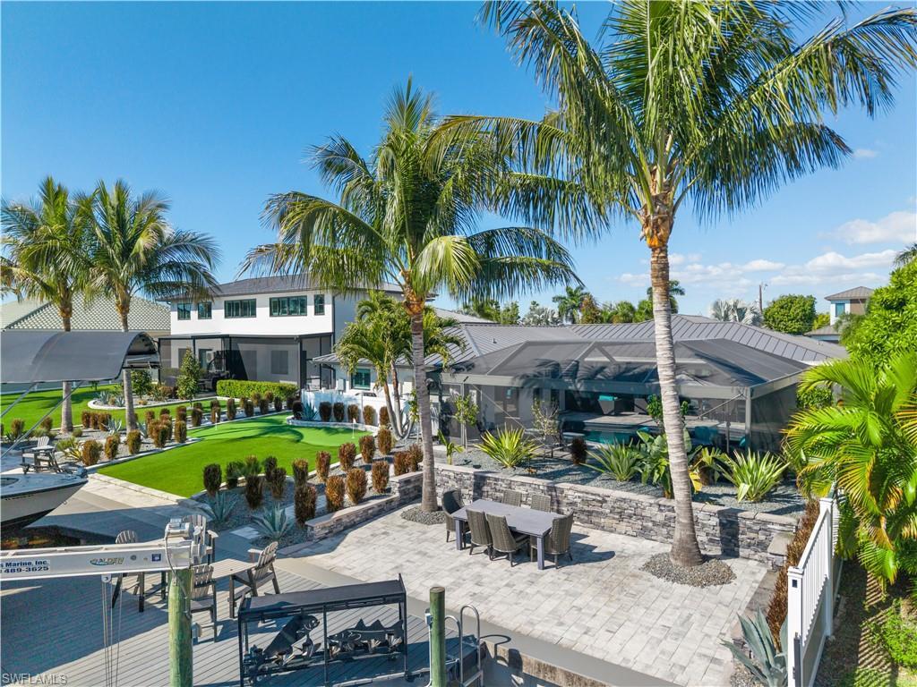 Image 3: View of patio with a lanai and an outdoor pool