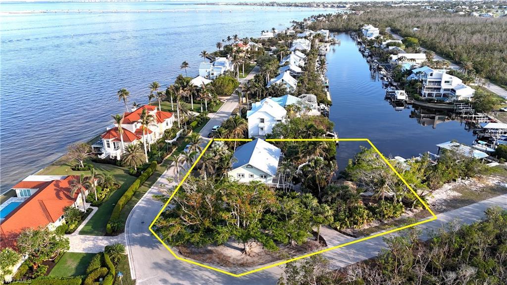 Image 1: Birds eye view of property with a water view