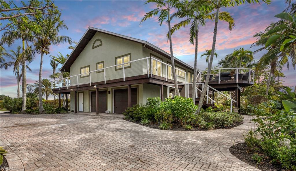 Image 3: View of front of house with a garage
