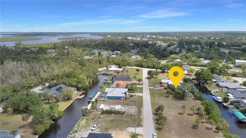 Image 1: Bird's eye view featuring a residential view and a water view