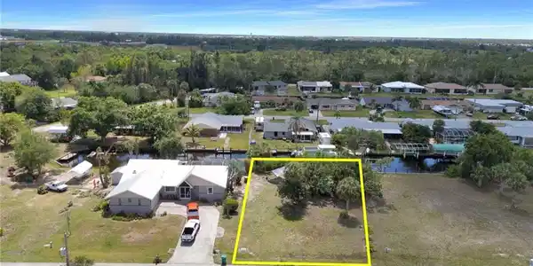 Image 3: Drone / aerial view with a forest view, a water view, and a residential view