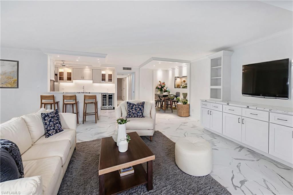 Image 1: Virtually staged to show furniture options-living room, dining & breakfast bar