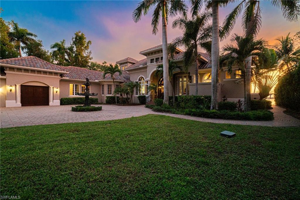 Image 3: Mediterranean / spanish home featuring decorative driveway, a garage, stucco siding, and a tiled roof
