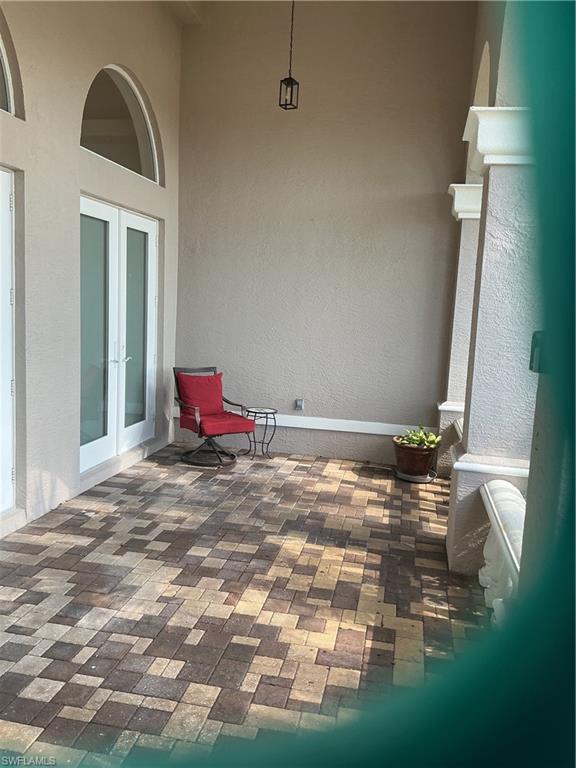 Image 2: View of patio featuring french doors