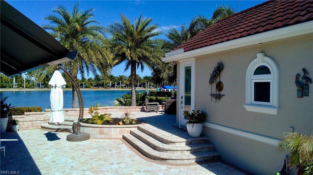 Image 4: View of patio / terrace with a water view