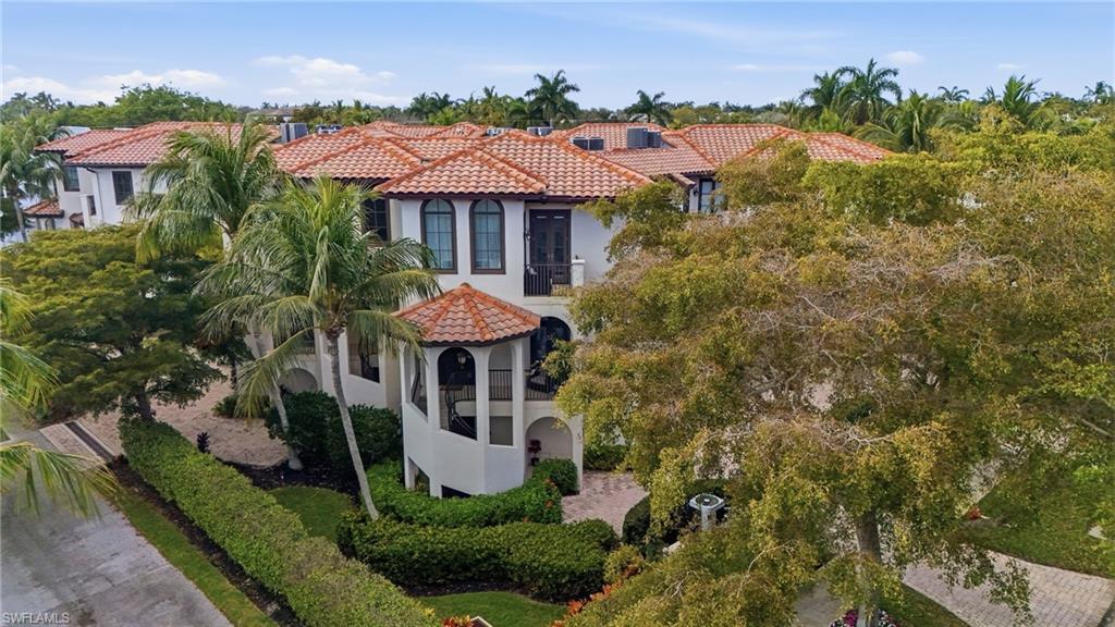 Image 3: View of front of home with stucco siding, a tiled roof, and a gazebo