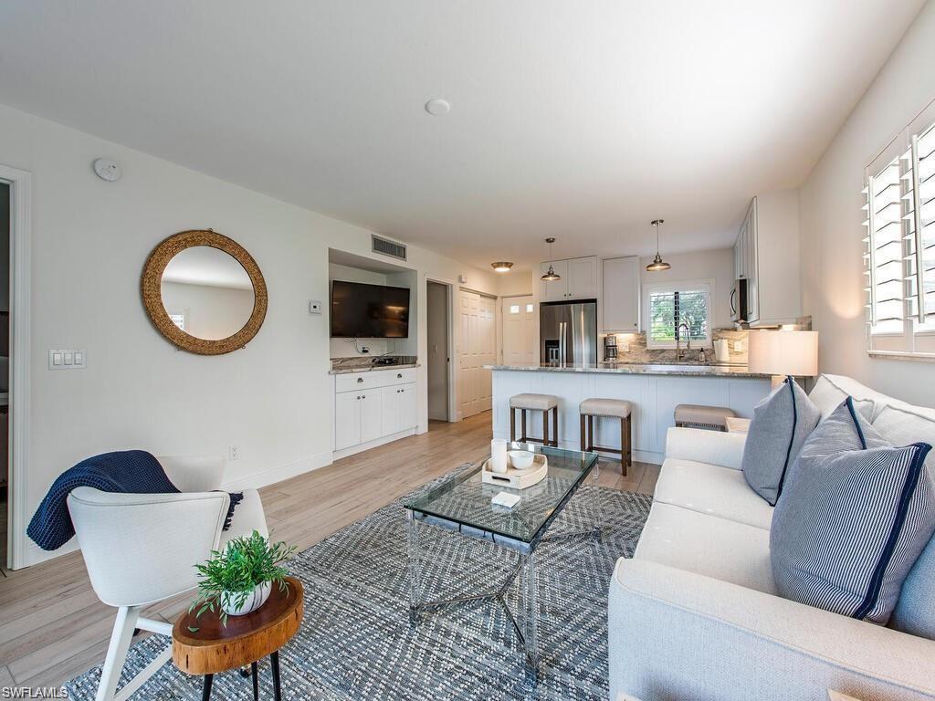 Image 1: Living room featuring light wood-type flooring