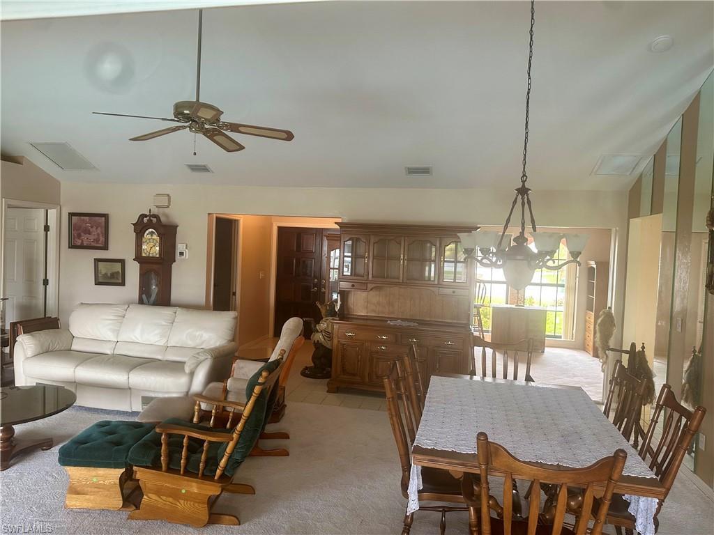 Image 3: Living/Dining from back Sliders