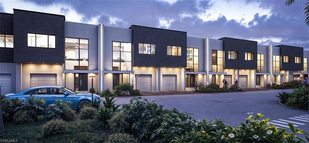 Image 1: Modern home featuring stucco siding