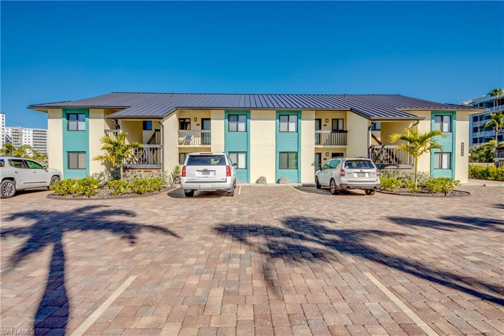 Image 2: View of property featuring uncovered parking