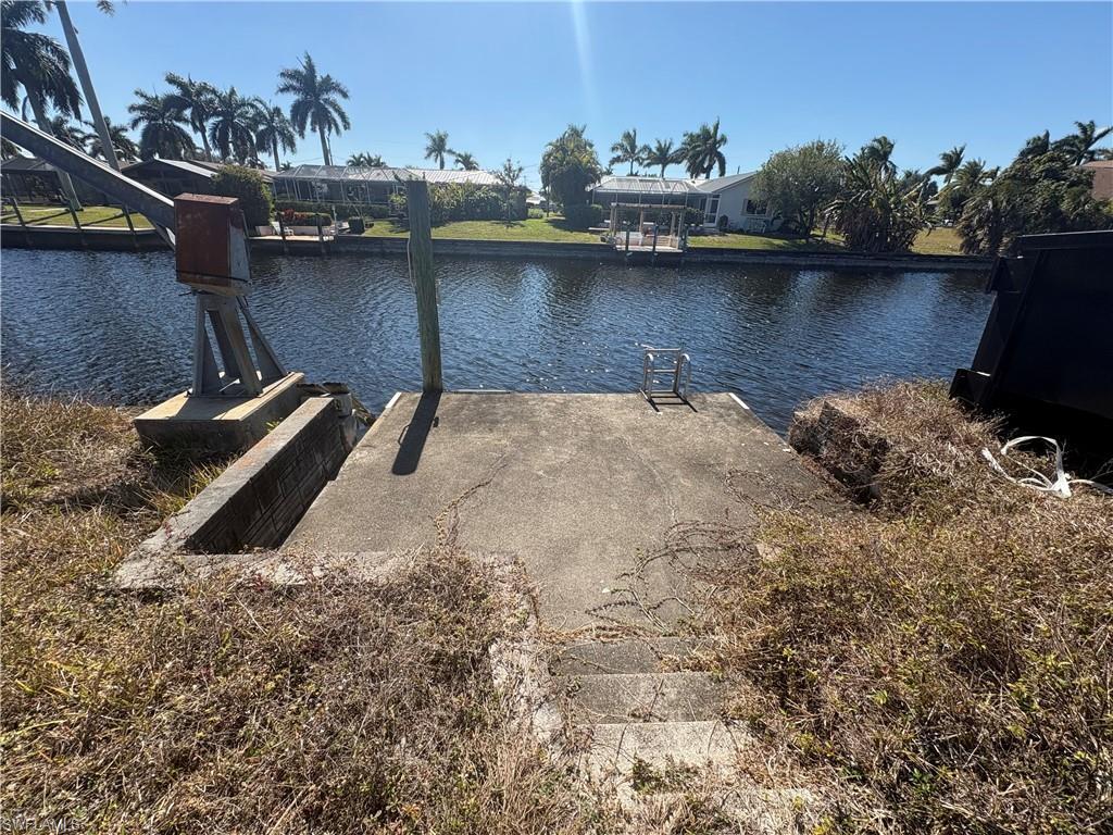 Image 3: Dock featuring a water view