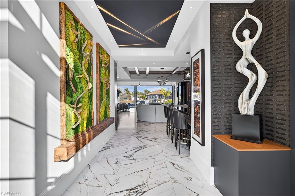 Image 2: Hallway featuring marble tiled flooring and recessed lighting
