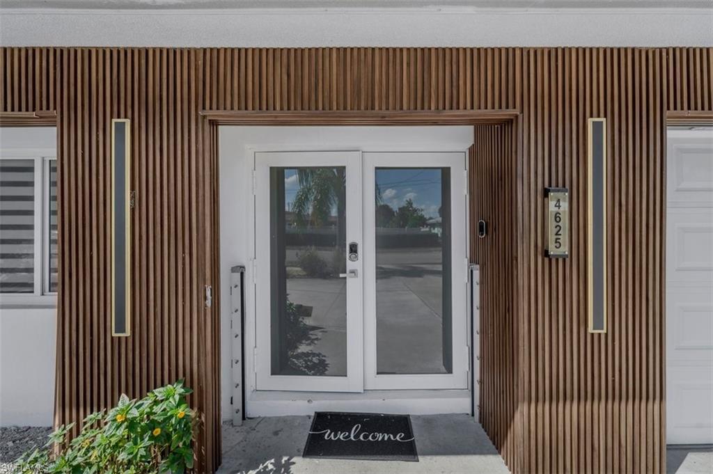 Image 3: View of exterior entry with french doors
