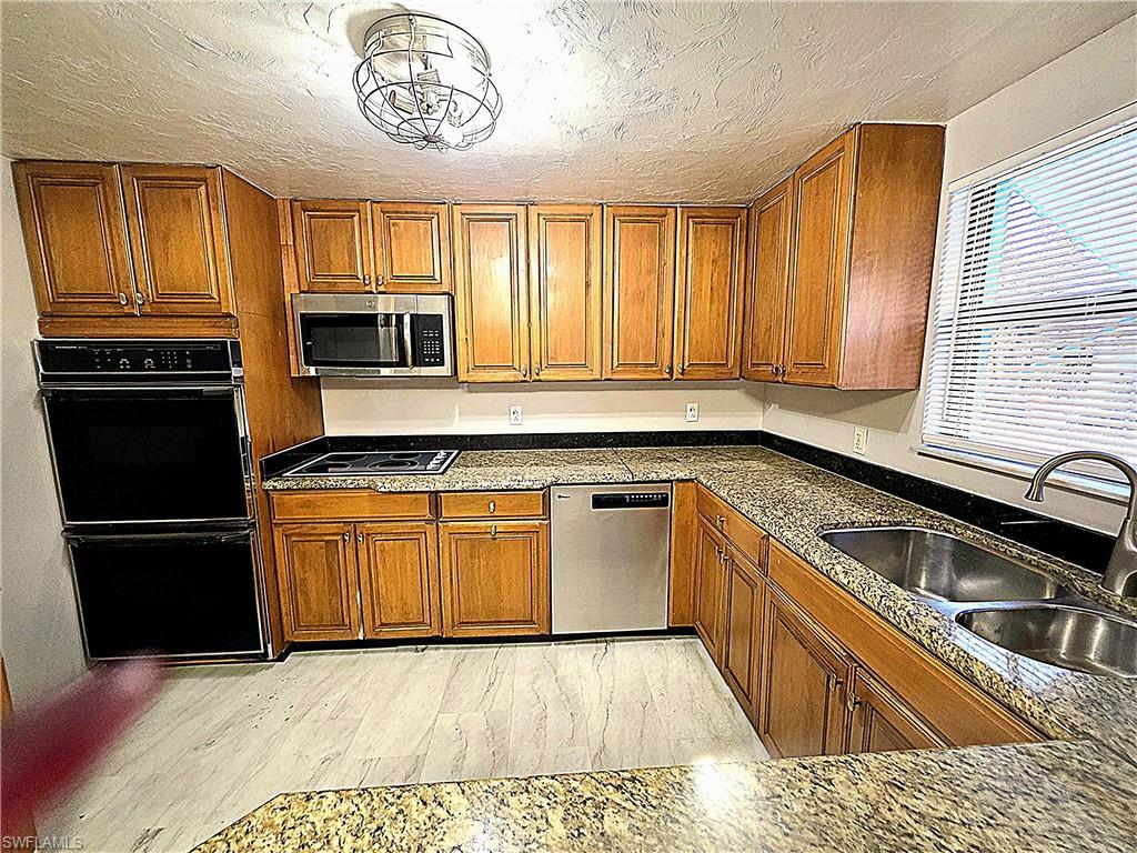 Image 1: Real wood cabinets, granite countertop