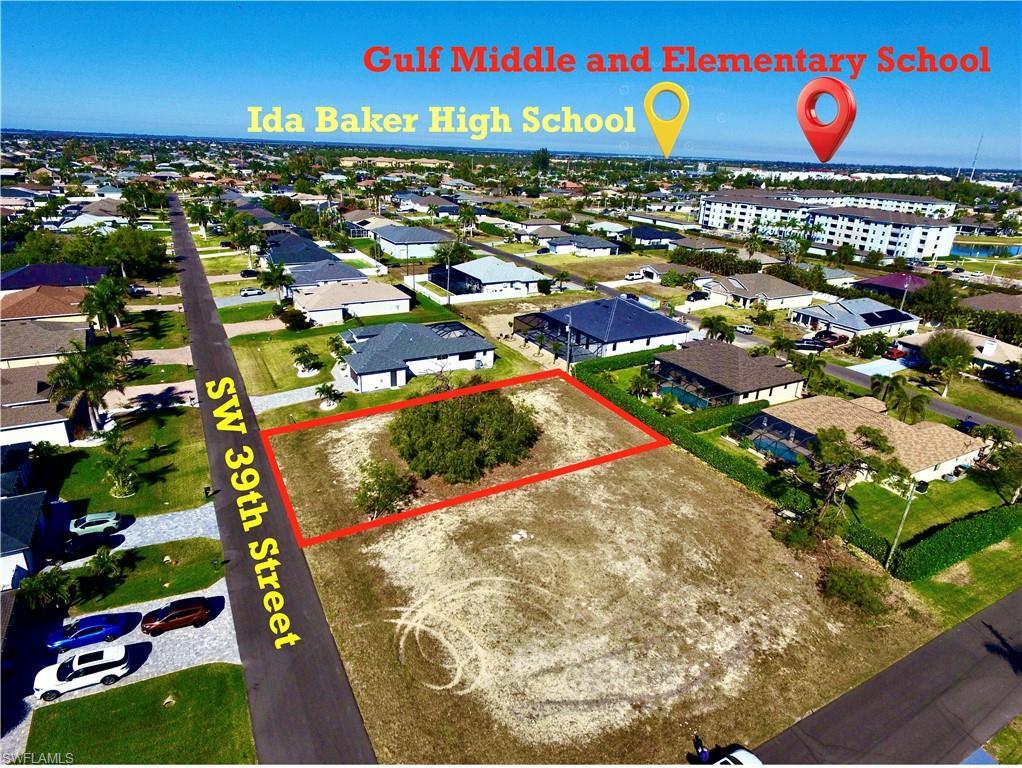 Image 1: Aerial view of residential area featuring property boundaries highlighted