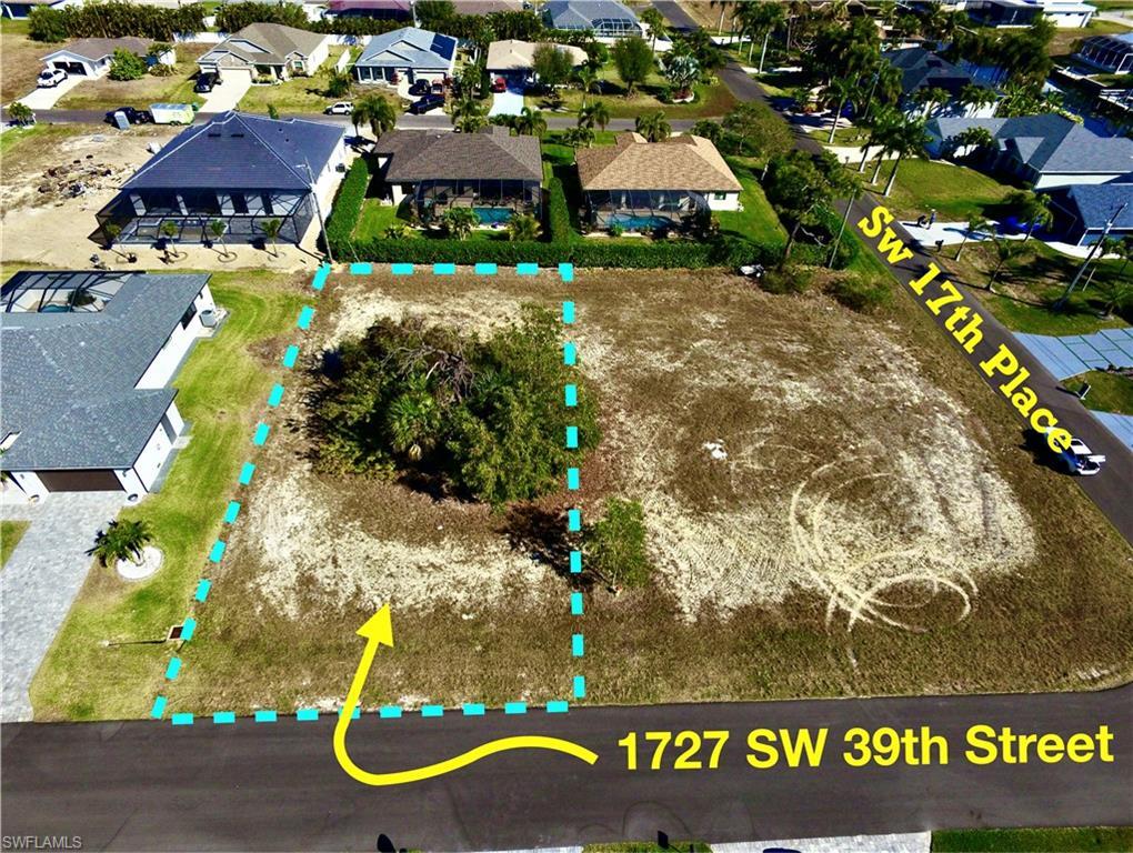 Image 2: Aerial view of residential area with property parcel outlined