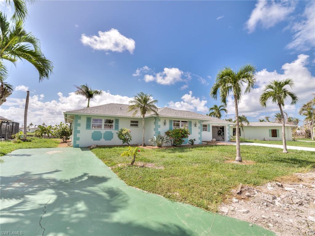 Image 3: Front of house showing RV or addition car parking