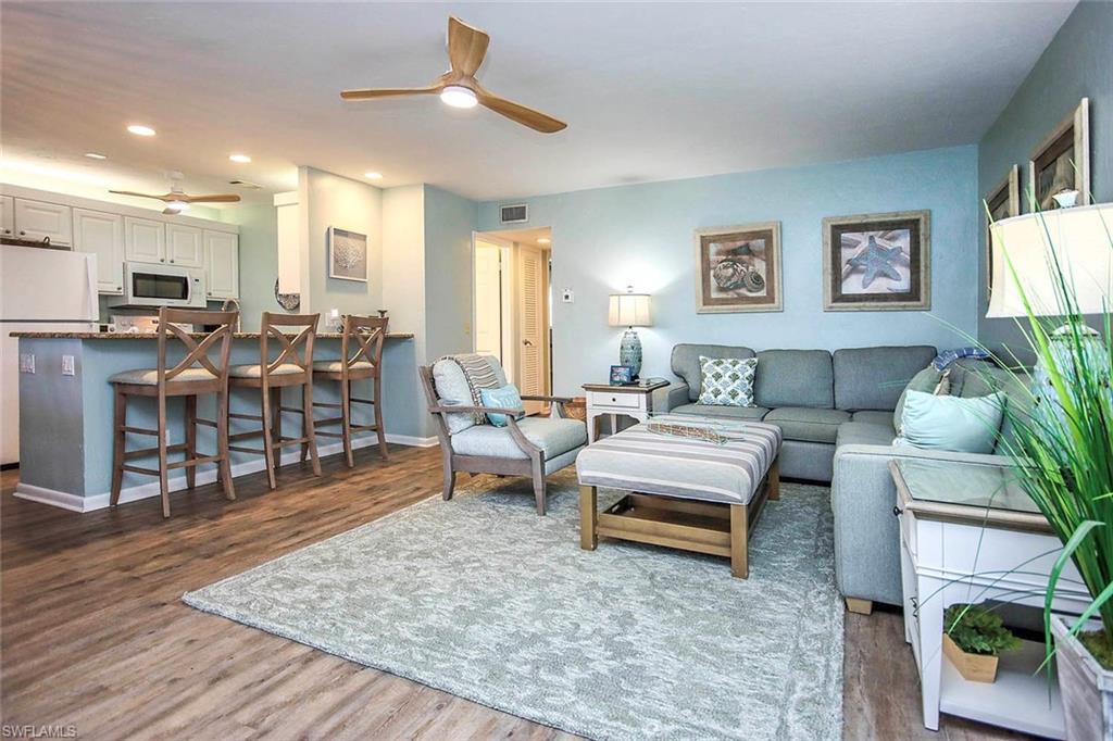 Image 2: Living room with visible vents, a ceiling fan, wood finished floors, recessed lighting, and baseboards