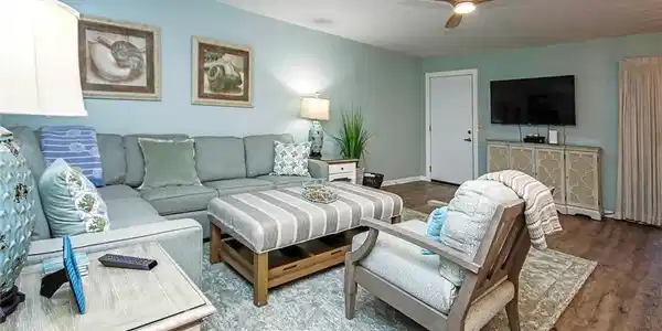Image 3: Living room with baseboards, ceiling fan, and wood finished floors