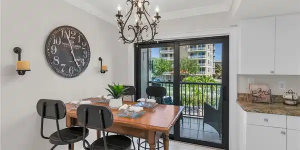 Image 4: Dining space featuring ornamental molding, a chandelier, and light tile patterned flooring