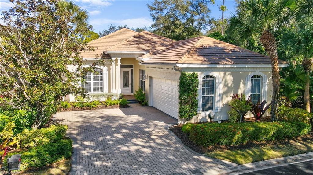Image 3: View of front of house with stucco siding, decorative driveway, a garage, and a tiled roof