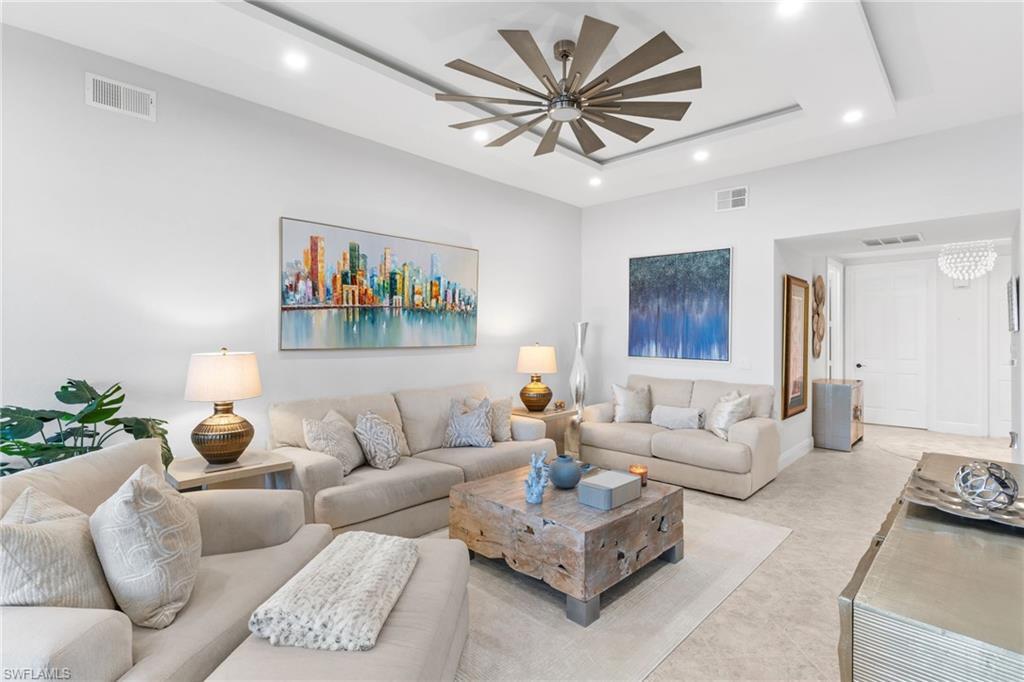 Image 4: Living area featuring recessed lighting, a raised ceiling, and ceiling fan