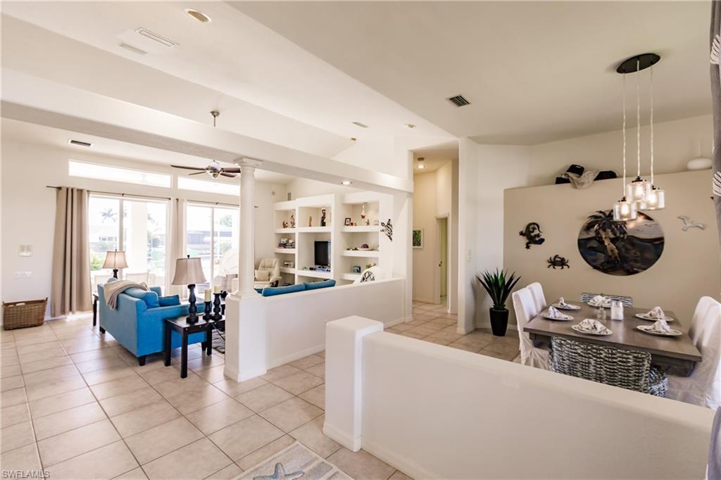 Image 4: Tiled living room featuring ceiling fan