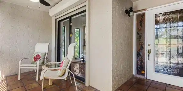 Image 4: Entrance to unit featuring screened balcony