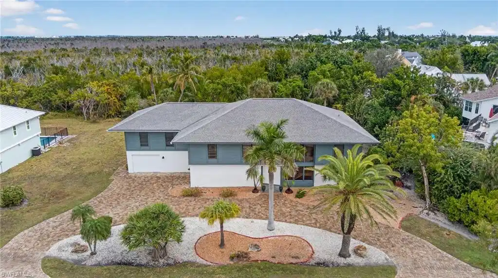 Image 1: Aerial view of property and surrounding area