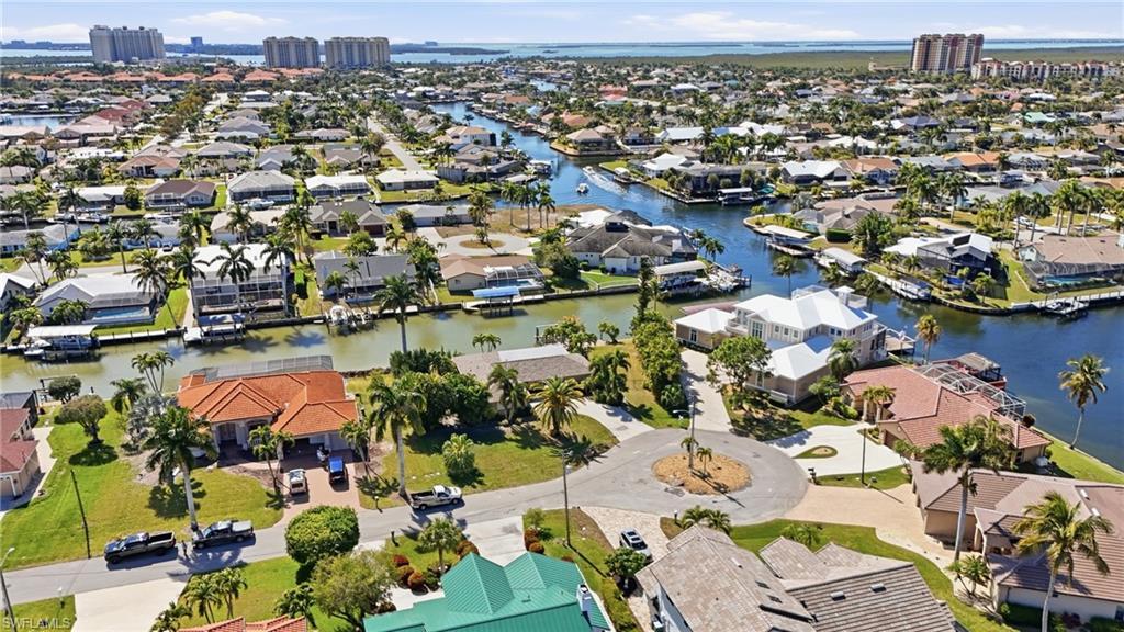 Image 3: View of urban area featuring a nearby body of water and nearby suburban area