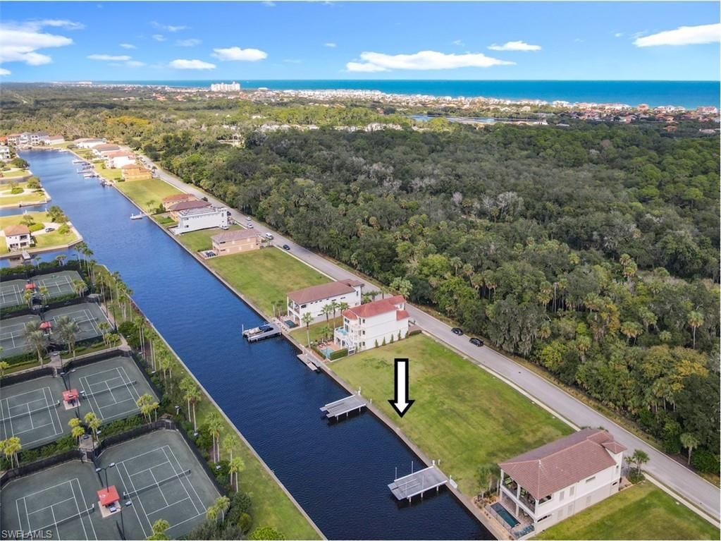 Image 2: Drone / aerial view of a large body of water and a forest