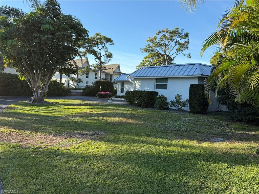 Image 2: View of grassy yard