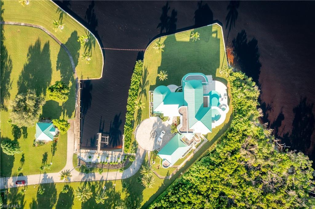 Image 4: View from above of property with a pool