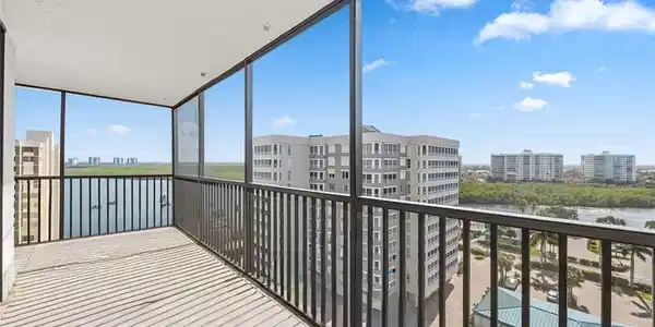 Image 2: Balcony with a sunroom and a water view
