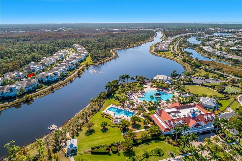 Image 2: Aerial view of a large body of water and a pool area