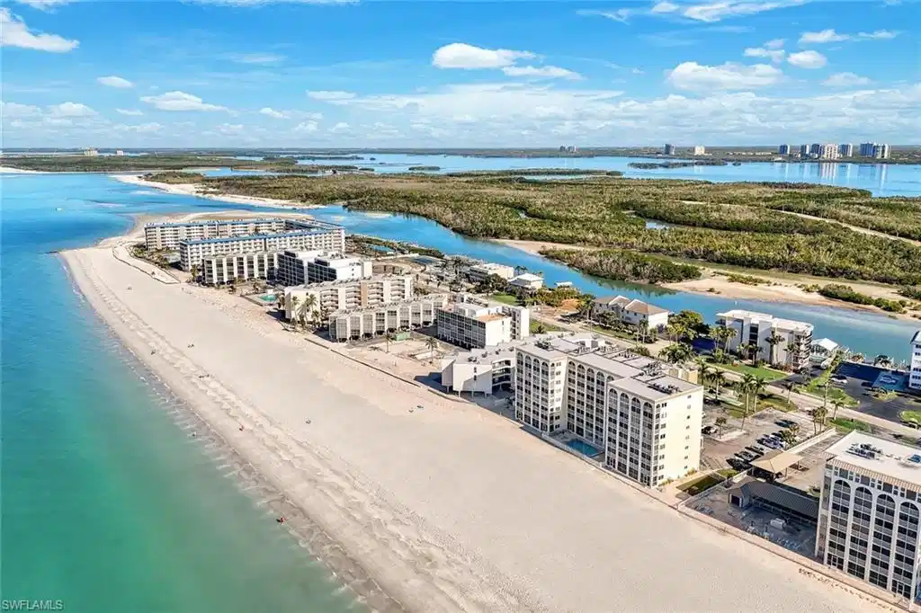 Image 1: View of urban area with expansive beach