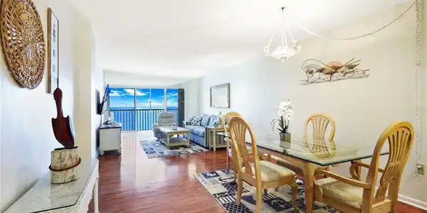 Image 4: Dining room with dark wood finished floors