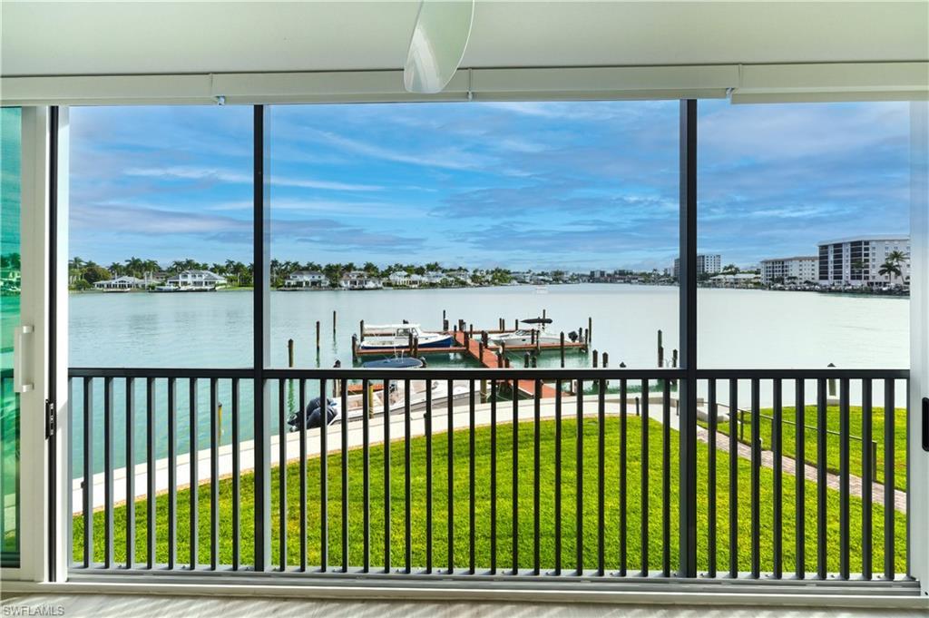 Image 1: Water view featuring a boat dock