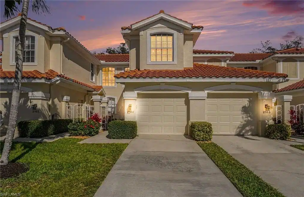 Image 1: Mediterranean / spanish home with driveway, a tile roof, and stucco siding