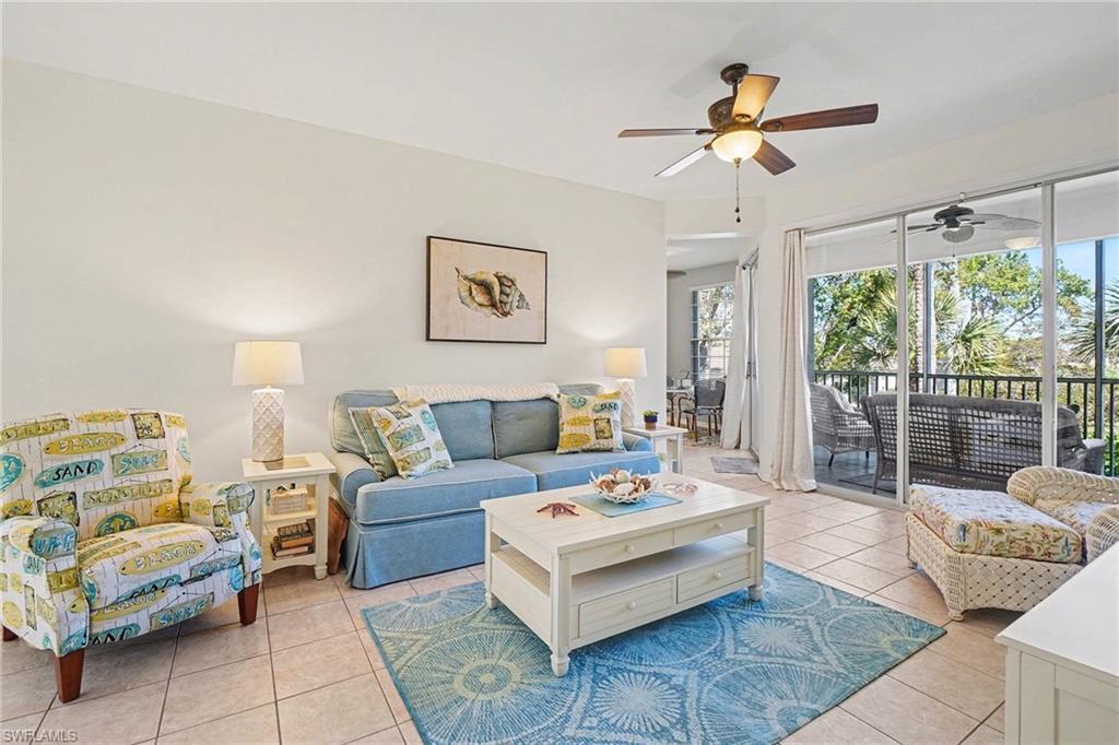 Image 4: Living area featuring ceiling fan and light tile patterned floors