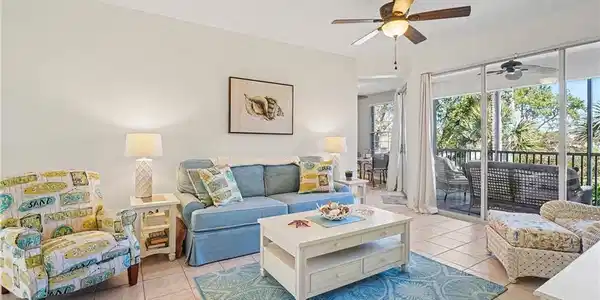 Image 4: Living area featuring ceiling fan and light tile patterned floors