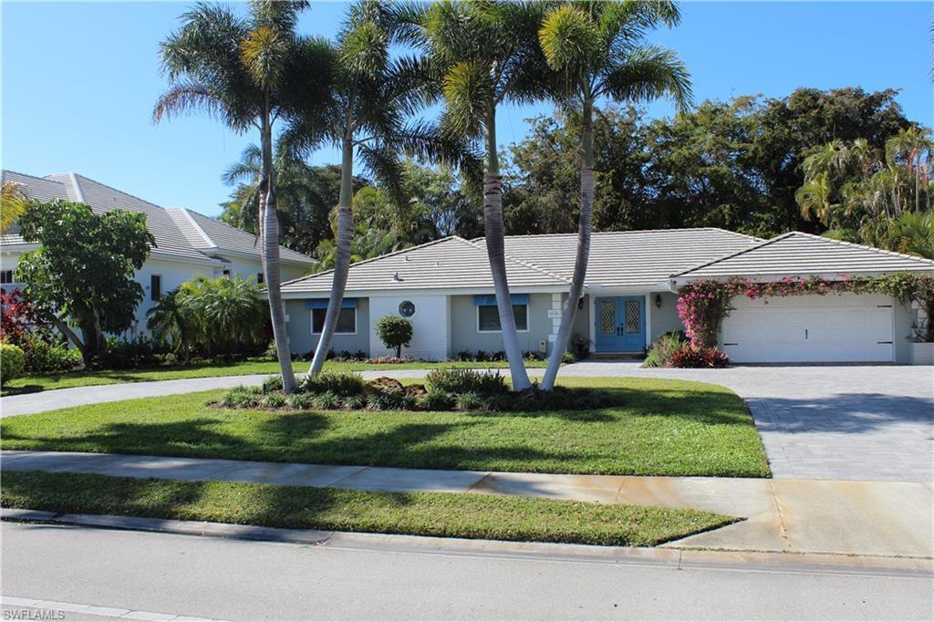 Image 3: Ranch-style house with driveway, a front lawn, french doors, and a garage
