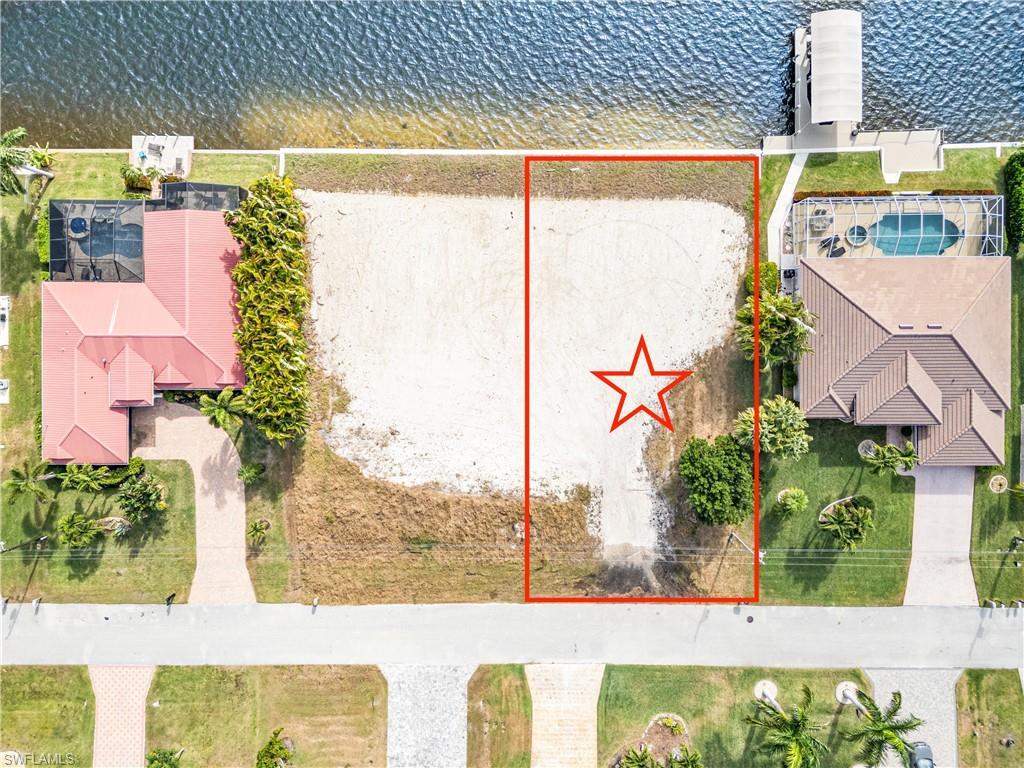 Image 4: View of property location featuring a nearby body of water and property parcel outlined